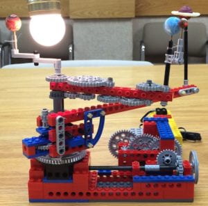 Small lego orrery with light bulb as a faux star