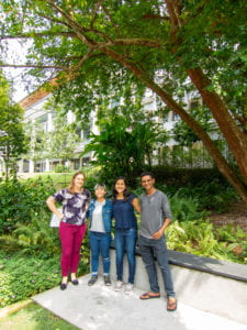Photo of the Sharon research group of Summer 2019 standing in the central part of Yale-NUS campus.